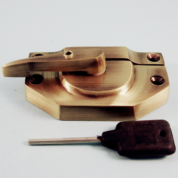 THD194L/AB • Locking • Antique Brass • Locking Modern Sash Fastener